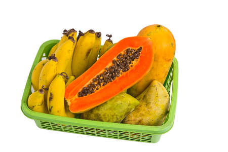Banana, papaya, mango in a basket on white background の写真素材