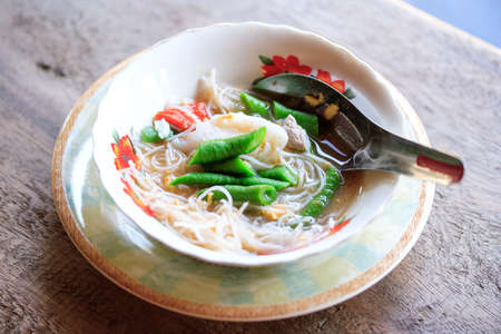 vermicelli noodles in bowls on wooden floor