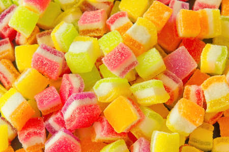 Background of colorful sprinkles, jelly for cake decoration or ice cream topping