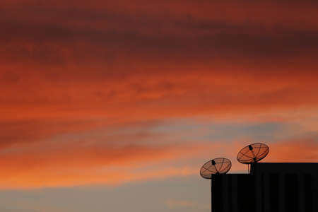 Satellite dish with evening sky./Satellite dish and evening-morning light sky for telecom and broadcastingの写真素材