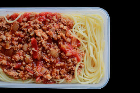 Spaghetti with plastic box, on black. Microwave Dinnerの写真素材