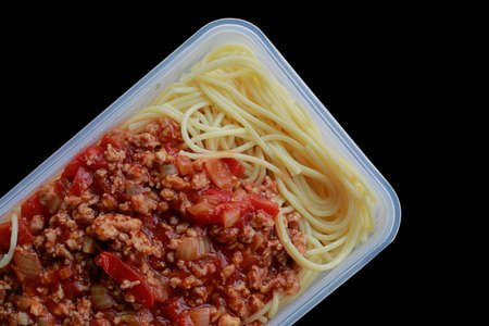 Spaghetti with plastic box, on black. Microwave Dinnerの写真素材