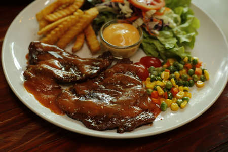 Steak, Sauce, Vegetable, French Fries.の写真素材