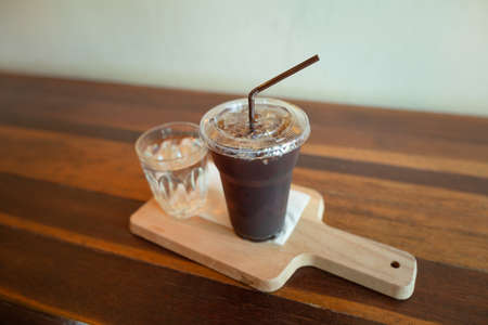 Back coffee on wood background.