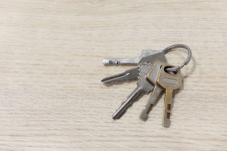 Shots House keys on a table wood.