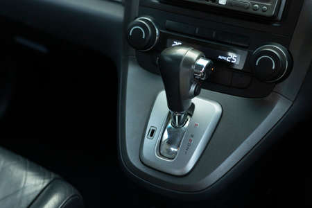 Put a gear stick into P position, (Parking) Symbol in auto transmission car.