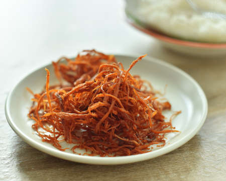 Crispy dried shredded pork on white background.の写真素材