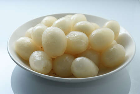 Rambutan in a white plate on a white background