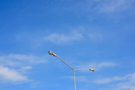 lamppost against the sky in the daytime