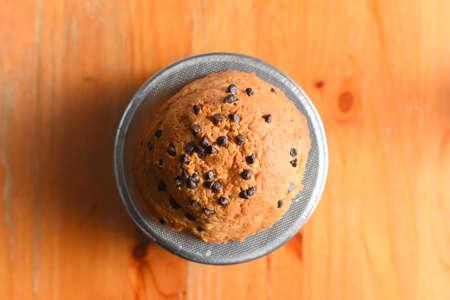 Bread in paper box on the wooden floorの写真素材