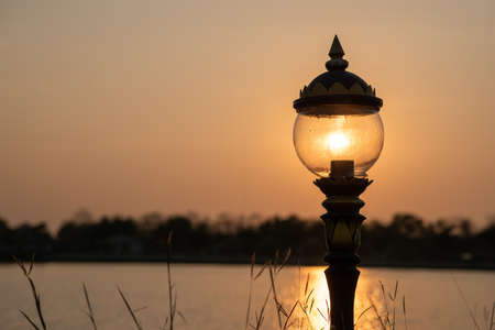 Lanterns in the garden and evening sunsetの写真素材