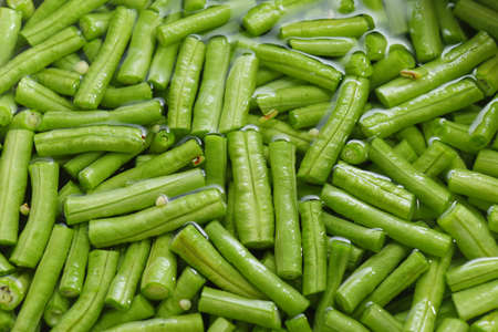 Long beans, cut into pieces, soaked in water food preparation processの写真素材