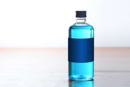 Blue alcohol bottle to wash woundsの写真素材