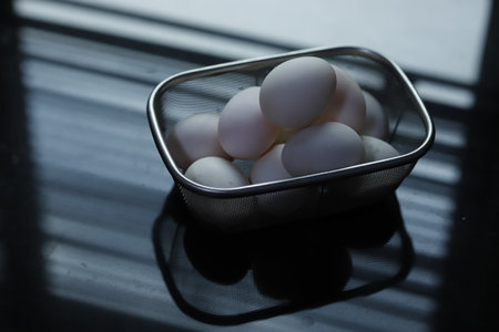 raw duck eggs in a basketの写真素材