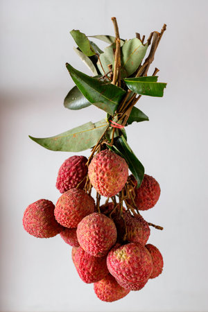 bunch of lychees on a white backgroundの写真素材