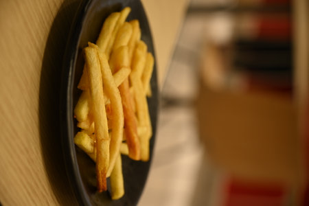french fries in a black plateの写真素材