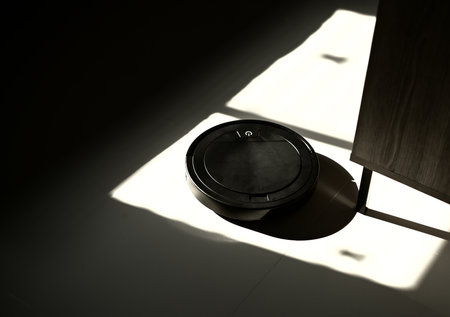 vacuum cleaner robot black in homeの写真素材