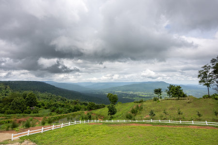 blue; hill; outdoor; countryside; green; summer; background; field; tree; sky; view; cloud; landscape; agricultural; travel; nature; meadow; farm; grass; mountain; agriculture; sceの写真素材