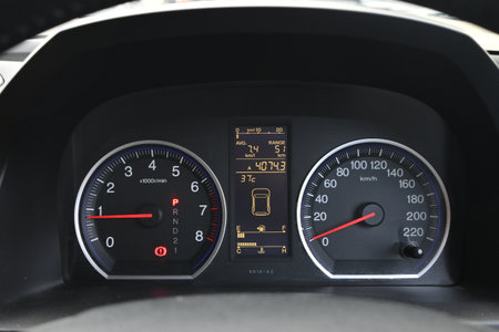 The carâ€™s instrument panel includes a speedometer, engine temperature gauge, gear position...