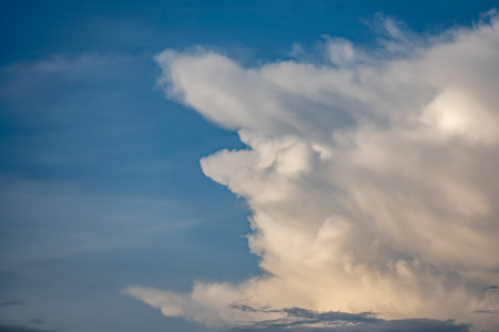 Soft clouds drifting across the sky after the rainの写真素材