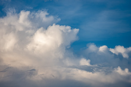 Soft clouds drifting across the sky after the rainの写真素材