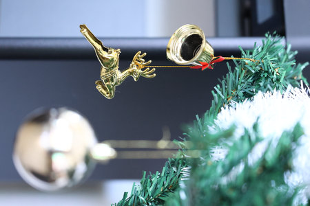Christmas decoration with angel and ball on green christmas tree background.の写真素材