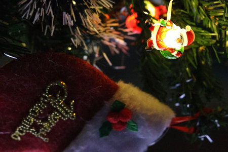 christmas decoration and santa claus hat on christmas treeの写真素材