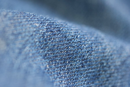 Denim fabric in a close-up shot showing the textureの写真素材
