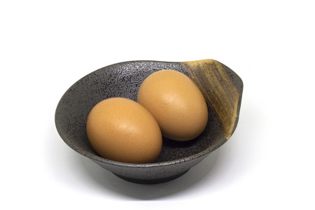 Brown Egg in the Cup on White Background with copy spaceの写真素材