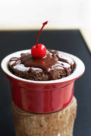 Chocolate souffle with cherry on topの写真素材