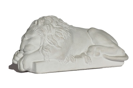 Figurine of sleeping lion on the pedestalの写真素材
