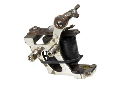 Old tattoo machine isolated on whiteの写真素材