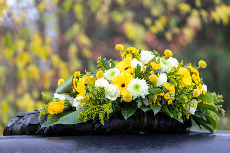 Funeral wreath with yellow and white flowersの写真素材