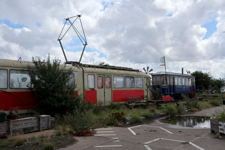 Two old trams on the NDSM wharf site in Amsterdam North, Netherlandsのeditorial素材