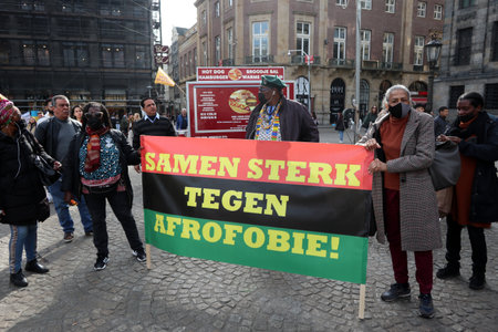 Amsterdam, The Netherlands 3-13-2022: Demonstration against Africa phobia on Dam Square in Amsterdam, The Netherlandsのeditorial素材