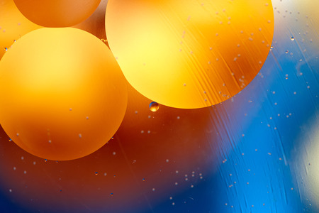 Colorful abstract macro background with oil drops in water.の写真素材