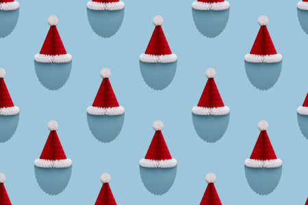 Santa paper Christmas hat with beard shaped shadow. Seamless pattern. Top Viewの写真素材