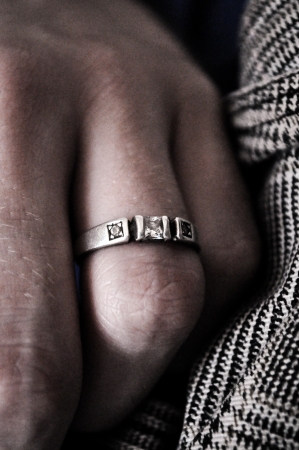 clad ring on the fingerの写真素材