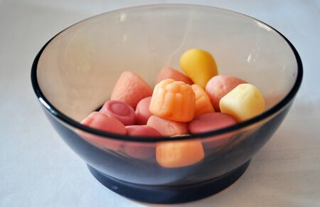 sweet colored jelly in tea bowls of brown glassの写真素材