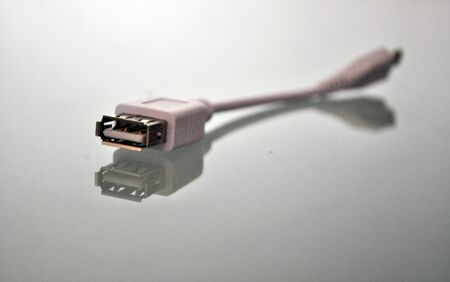 white usb adapter on a reflecting underground