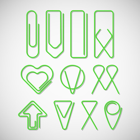 Green paper clips isolated on white backgroundのイラスト素材