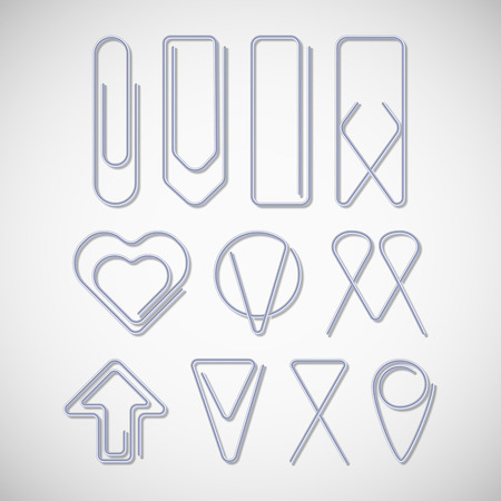 Silver paper clips isolated on white backgroundのイラスト素材