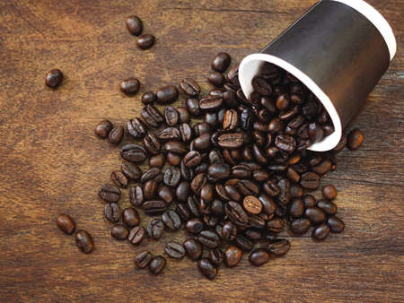 Top view coffee table with copy space for your text, Coffee beans and coffee cup on wooden...