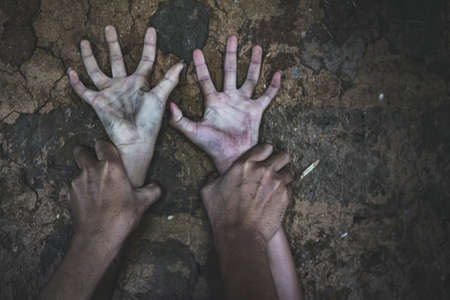 Hands for rape and sexual abuse concept.Sexual abuse is a problem or Social issues concept. Man's hand holding a woman hand for rape and sexual abuse.の写真素材