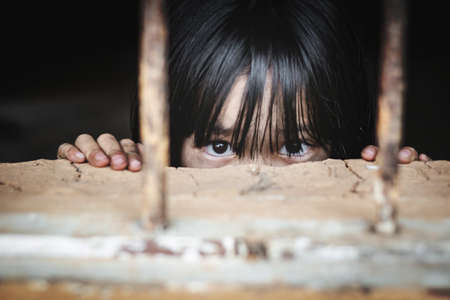 trafficking concept, human rights violations, children prison and prisoner concept,の写真素材