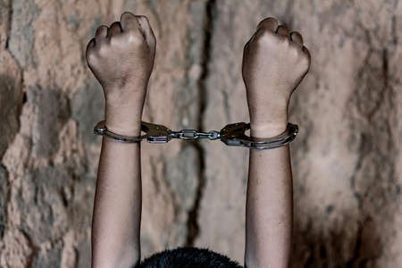 little boy with shackle. Abused and tortured concept. Human trafficking concept.の写真素材