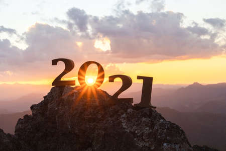 Silhouette of year 2021 with sunrise on mountain for New year success, Starting of New year concept.