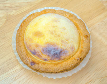 frozen cheese tarts on wooden table.の写真素材