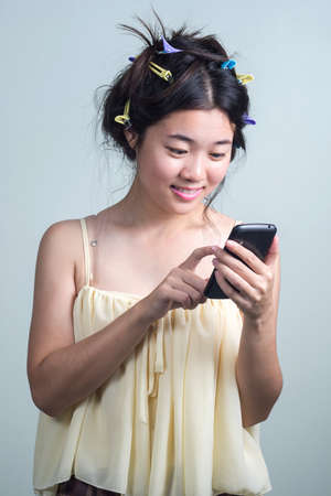Asian girl with mobile phone.の写真素材