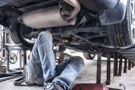man is Reparing car by weldingの写真素材